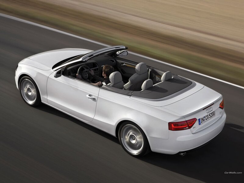 White Audi convertible in motion