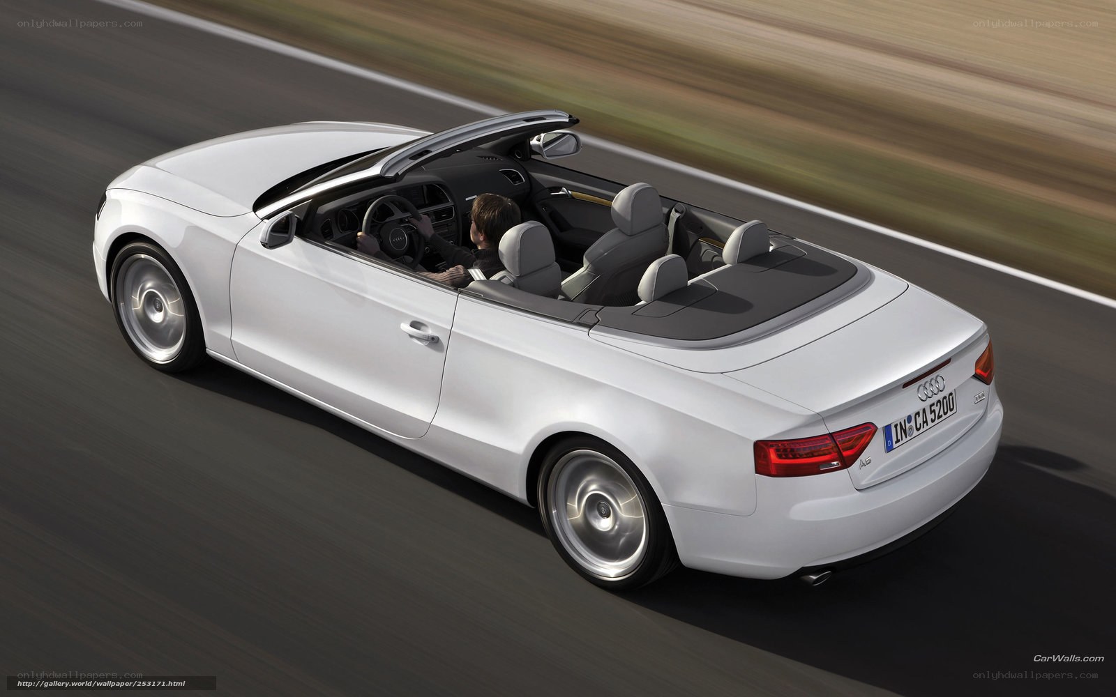 white audi convertible in motion