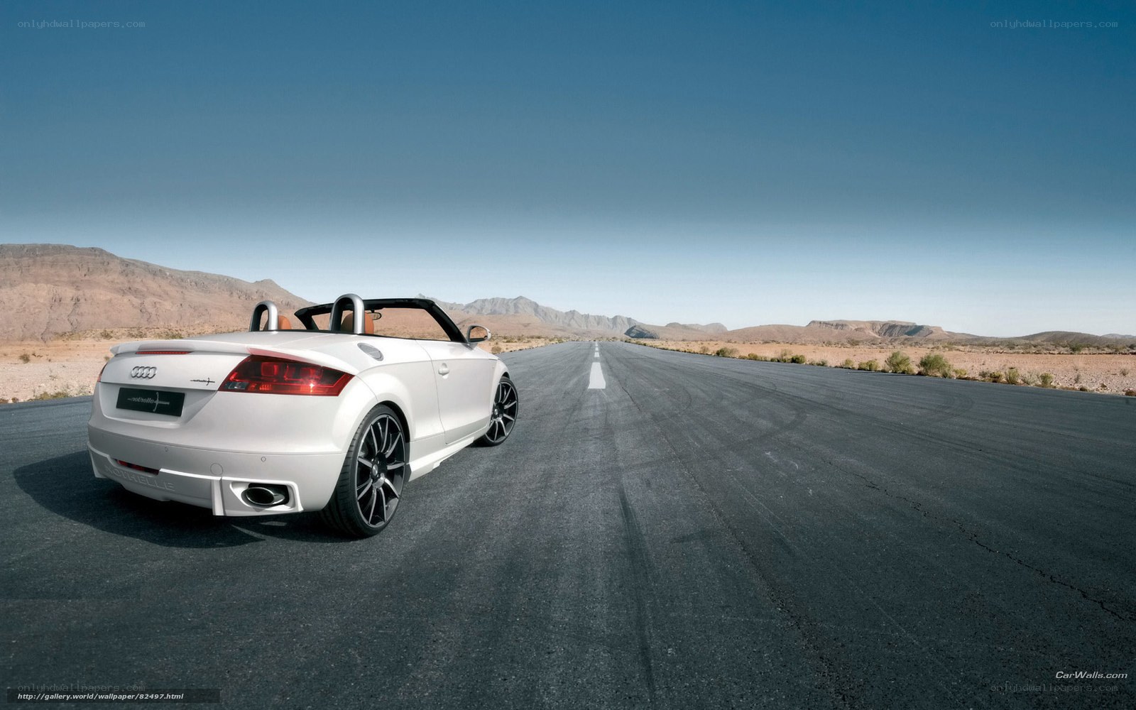 White Audi convertible on desert road