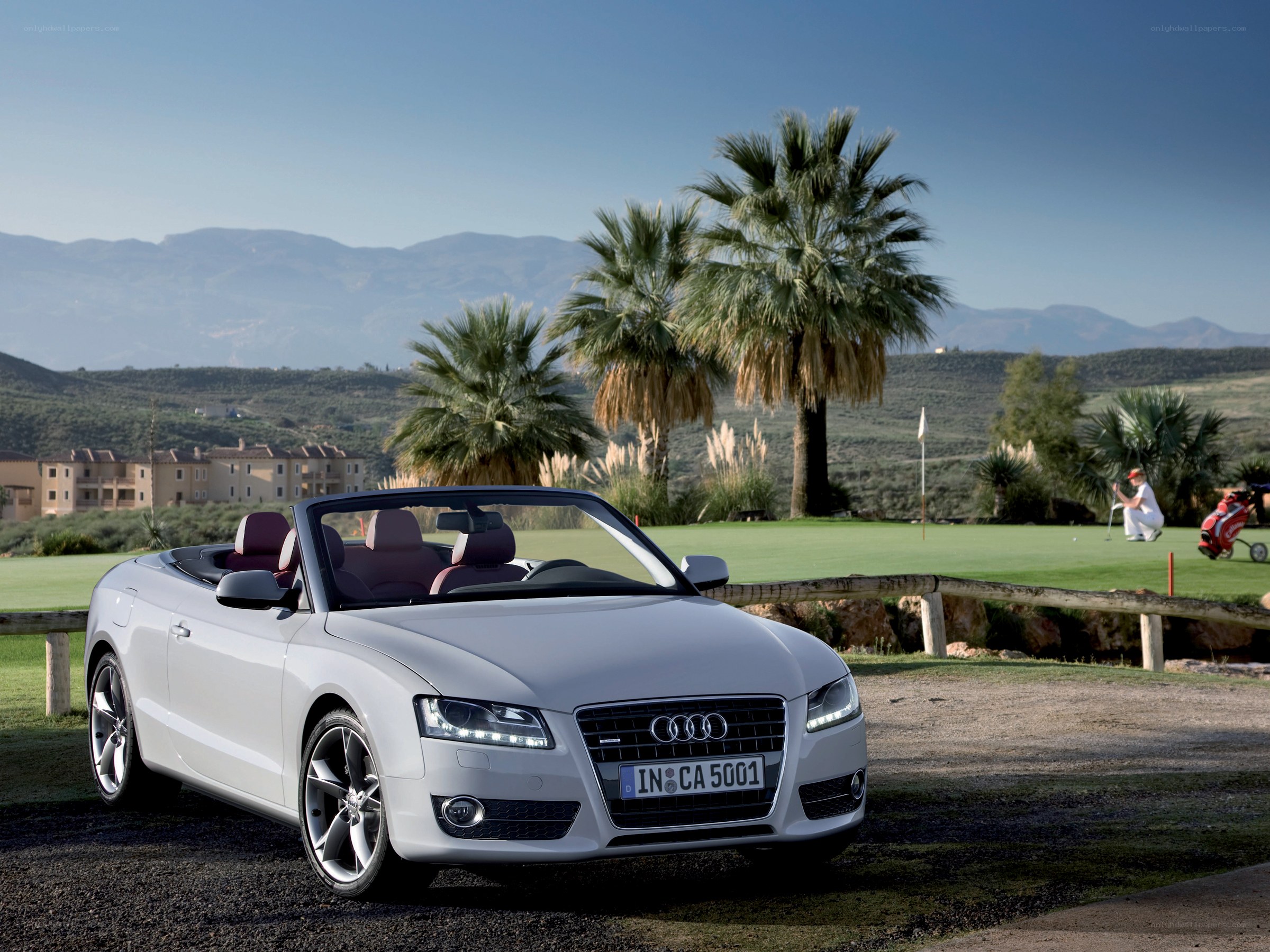 White Audi convertible on golf course