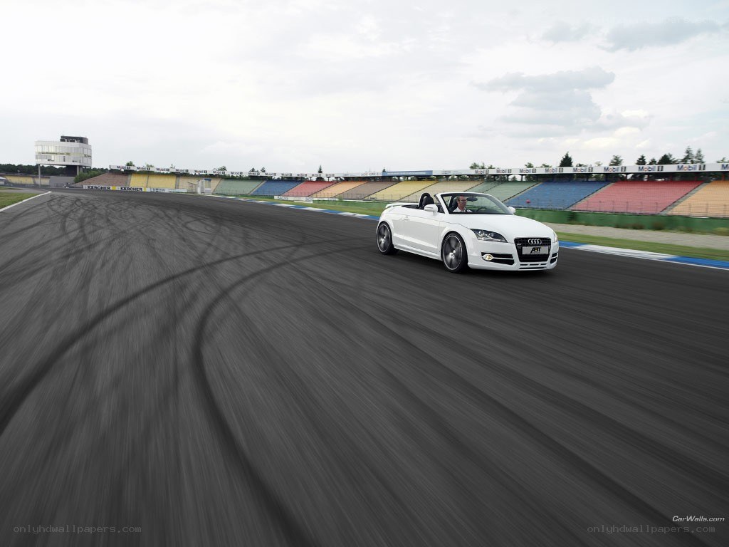 White Audi convertible on racetrack