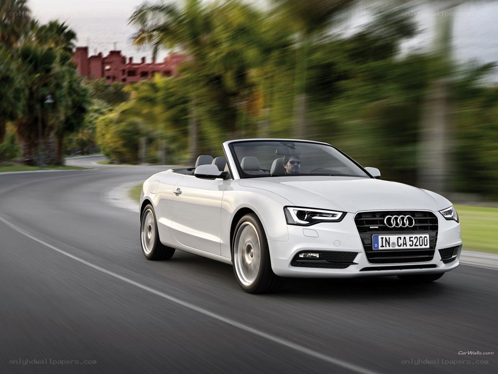 White Audi convertible on road