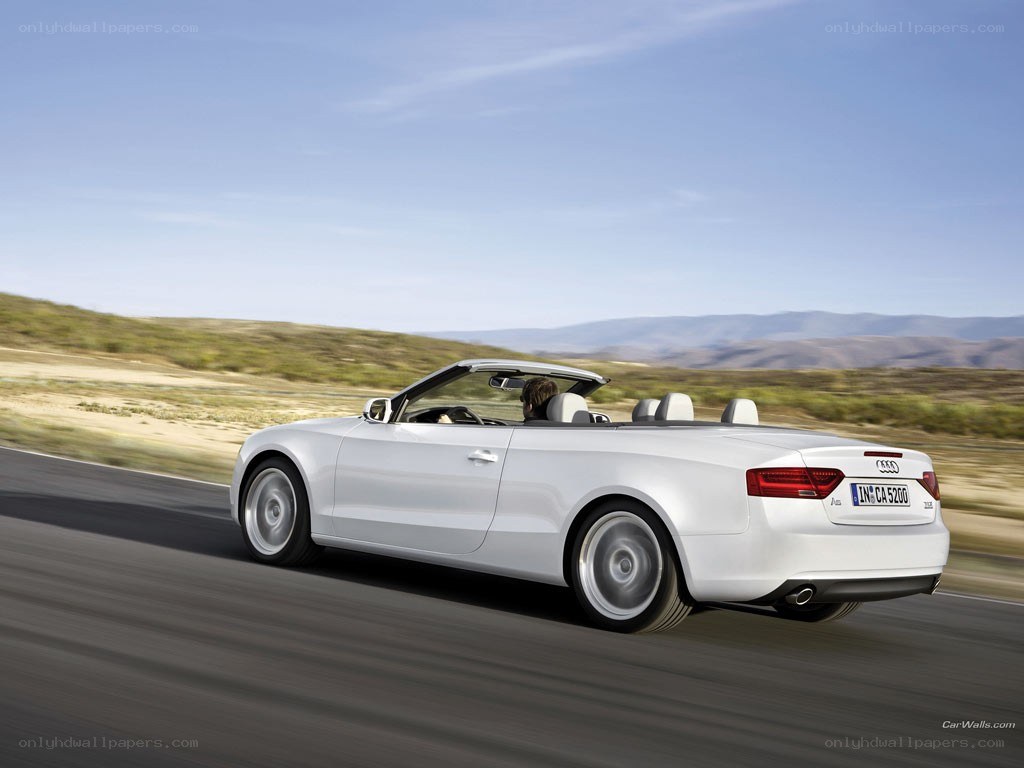 White Audi convertible on road