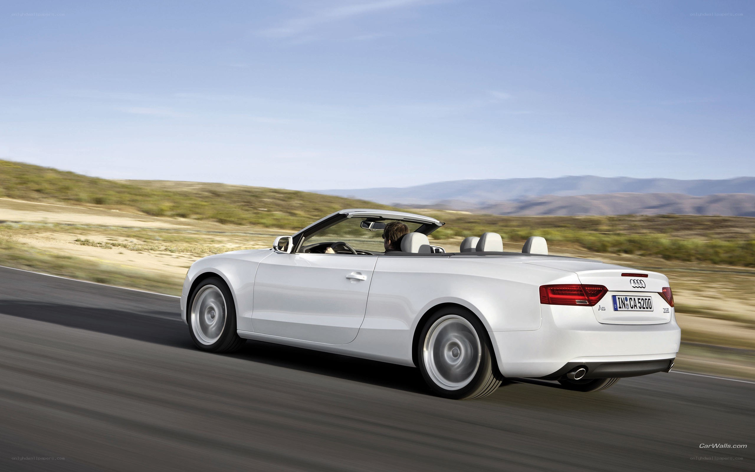 white audi convertible on road