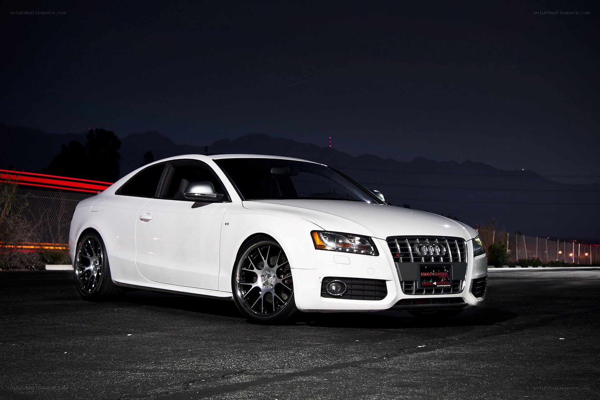 White Audi coupe at night