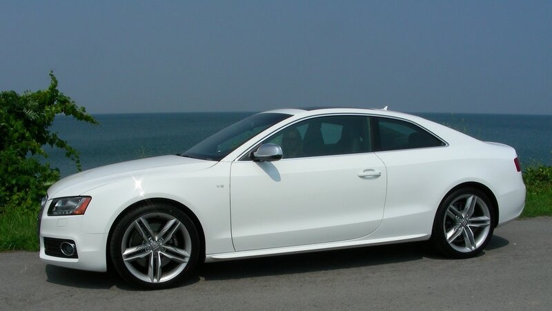 white audi coupe by the sea