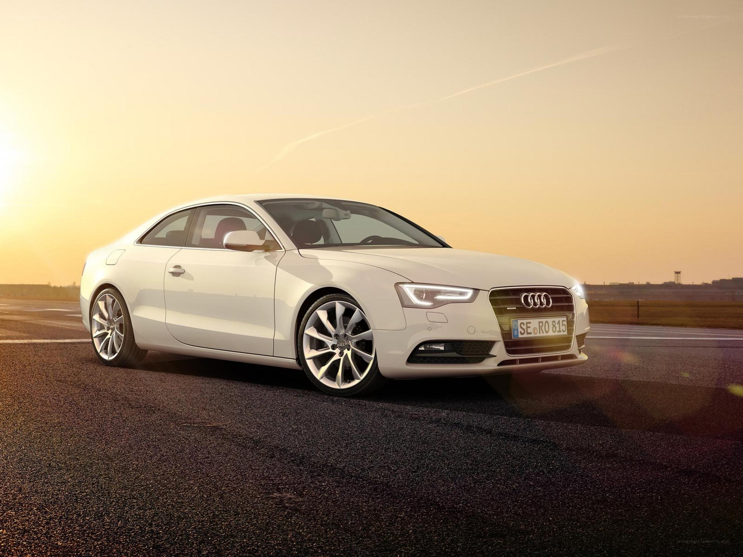 White Audi coupe on a track