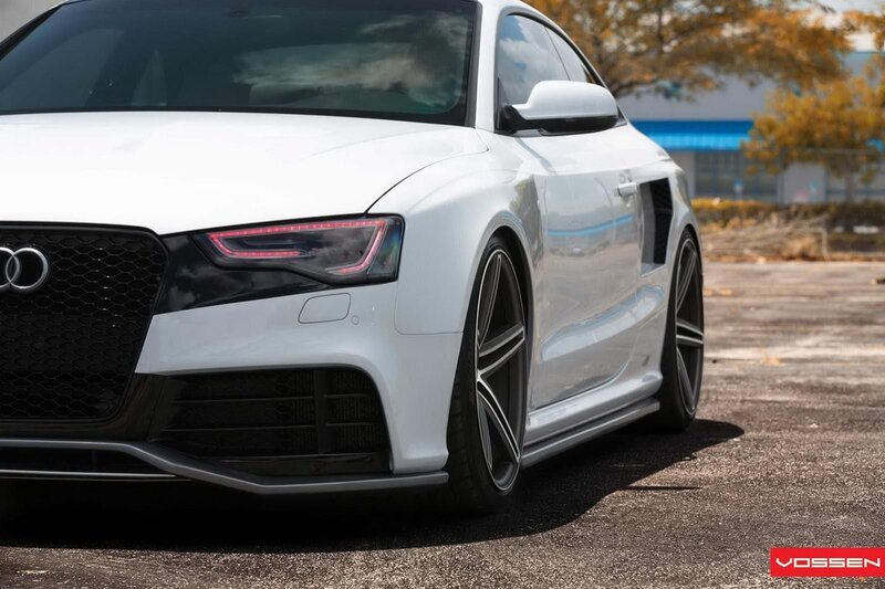 white audi coupe with custom wheels