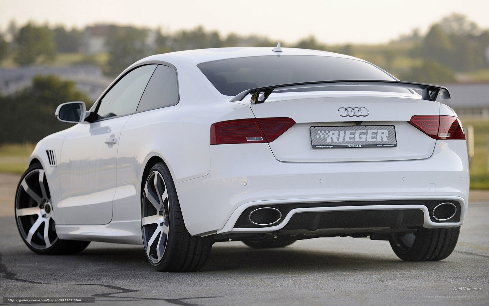 white audi coupe with rear spoiler