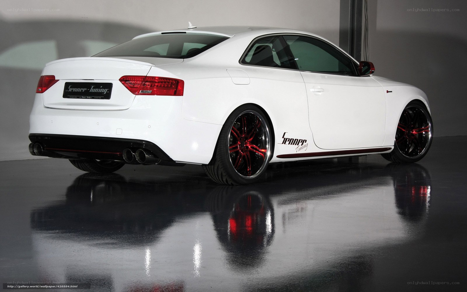 white audi coupe with red wheels
