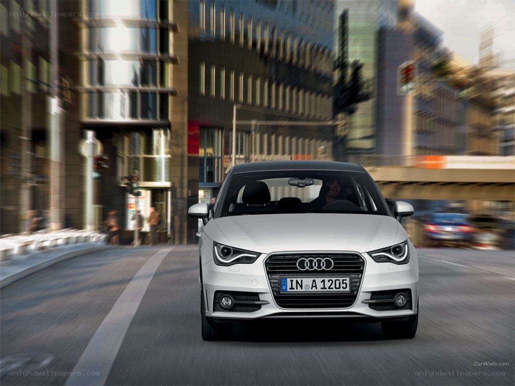 White Audi driving in city