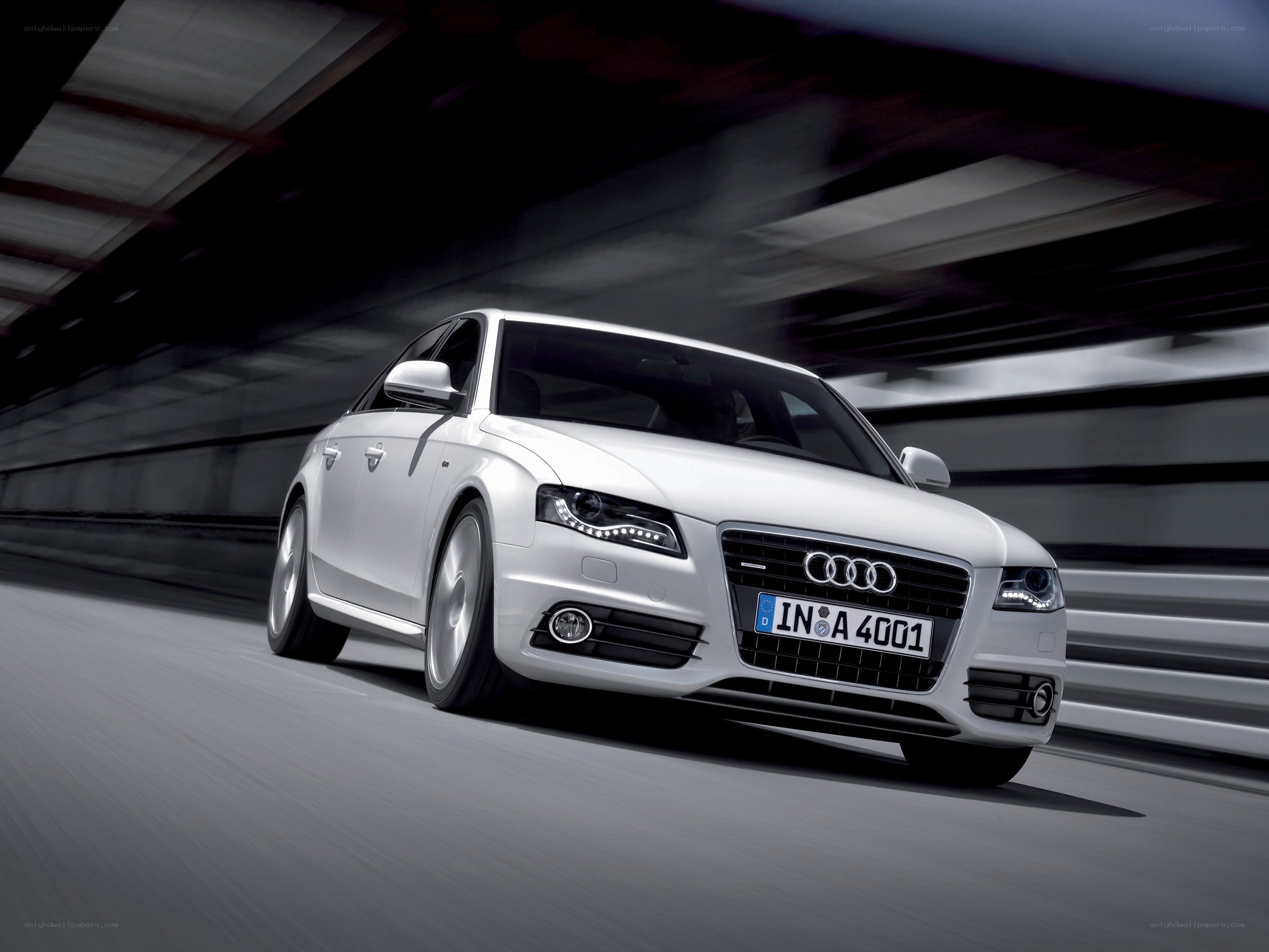 White Audi driving in tunnel