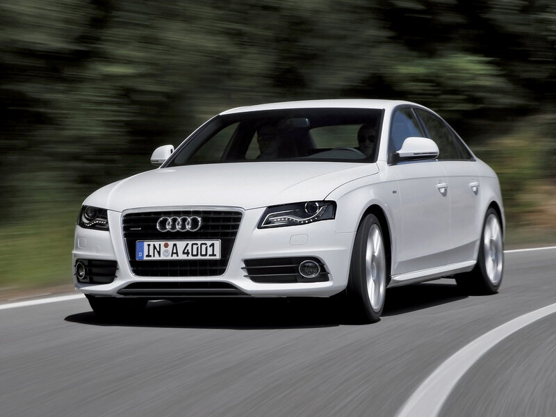 white audi driving on road