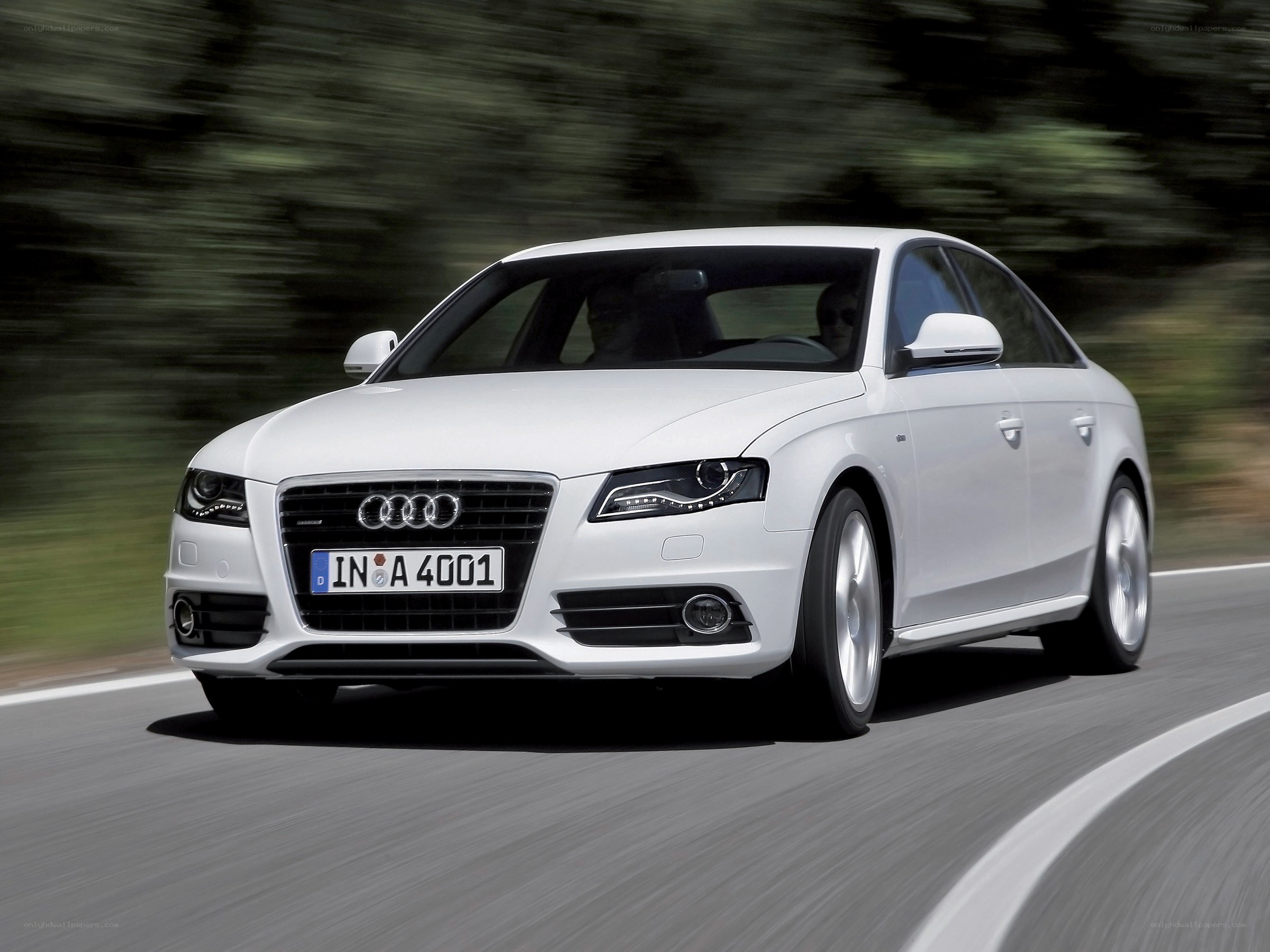 white audi driving on road