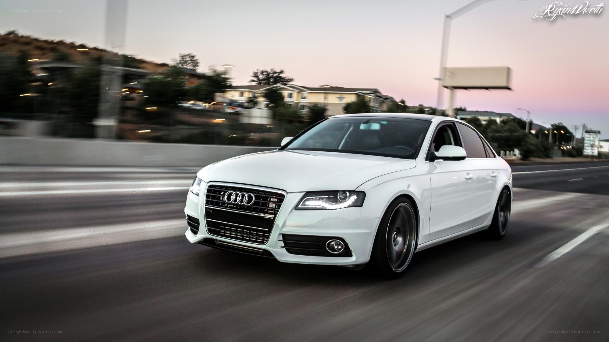 white audi driving on road