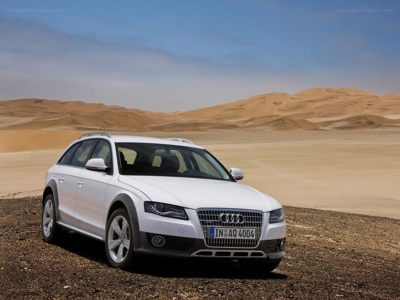 White Audi in desert landscape