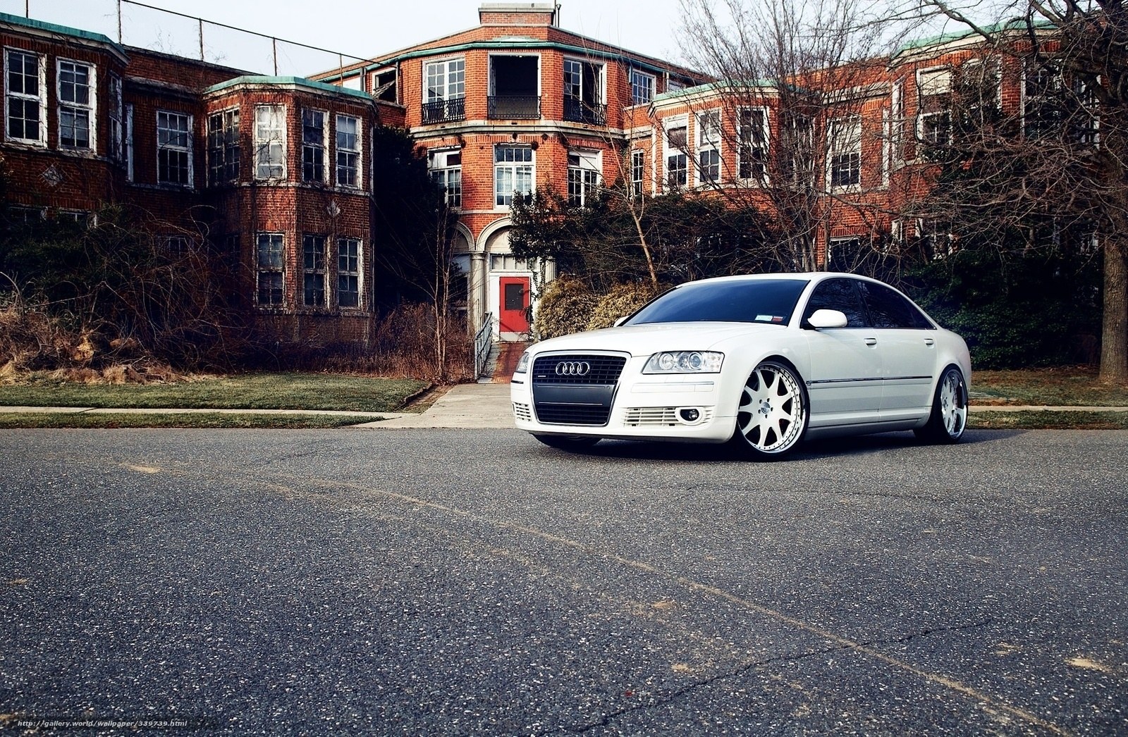 White Audi in front of old building