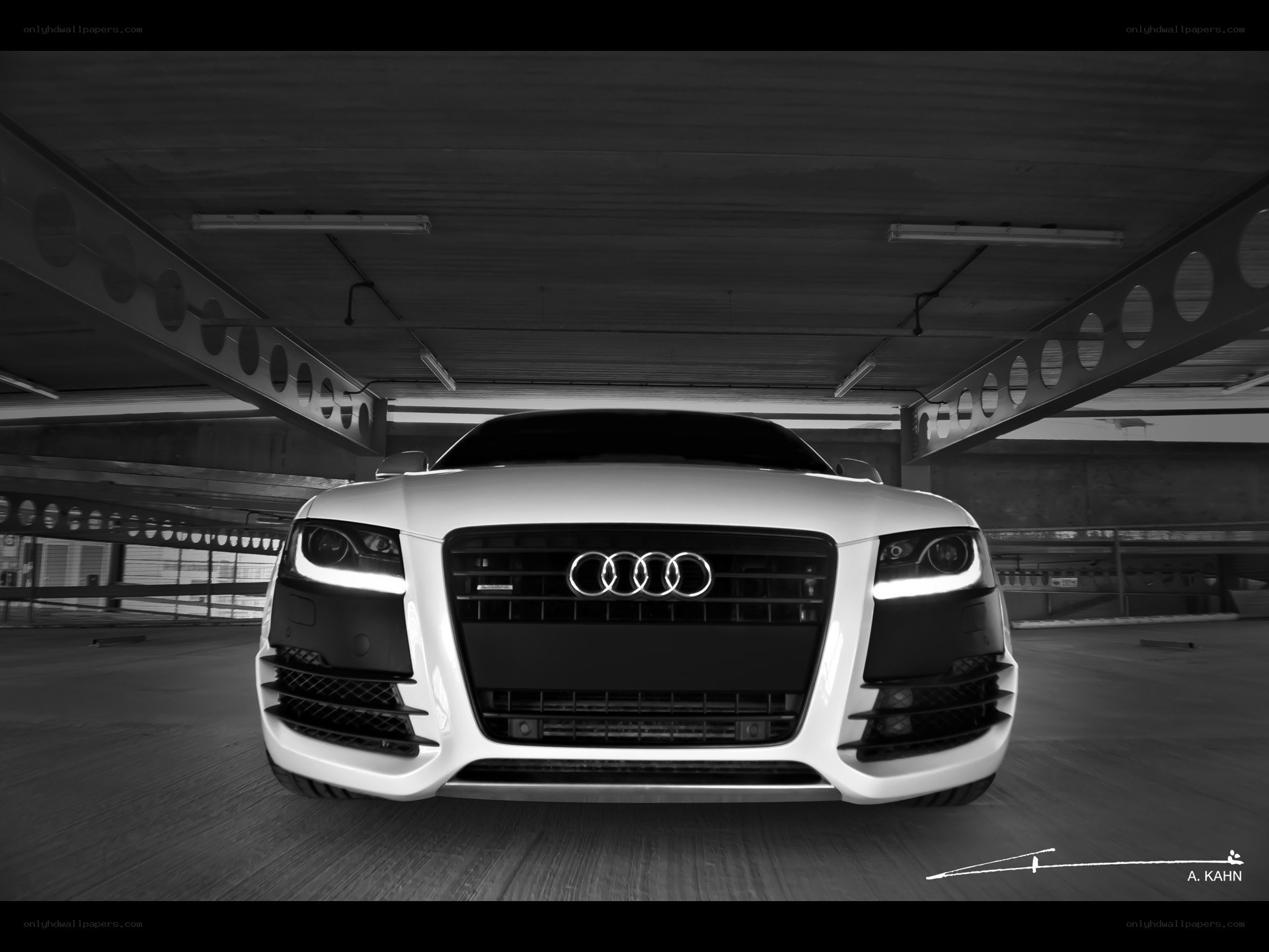 White Audi in parking garage