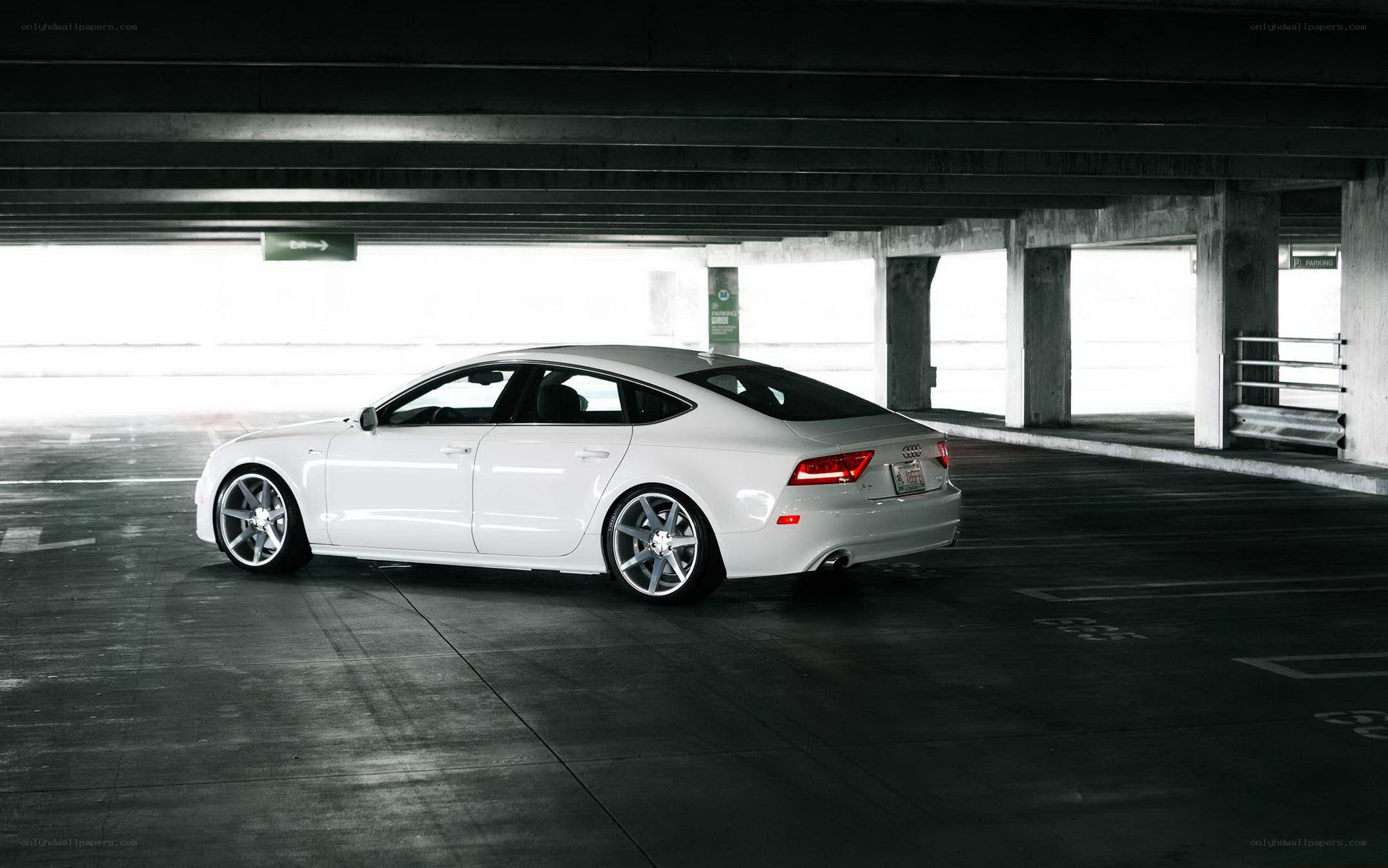 White Audi in parking garage