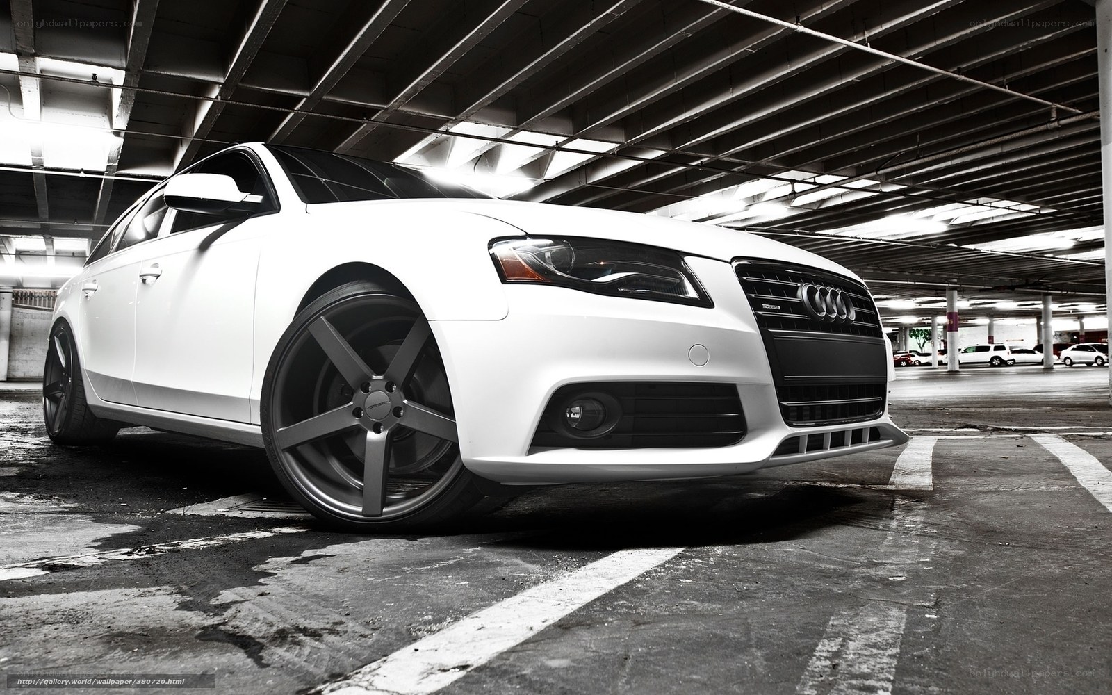 white audi in parking garage