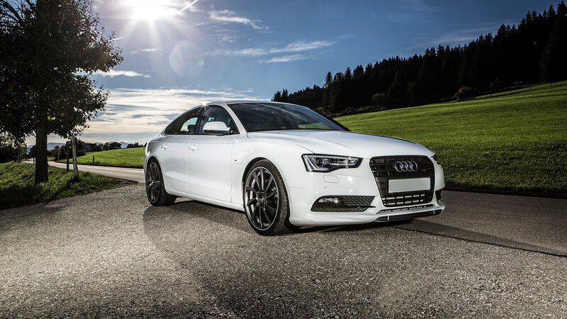 White Audi on a country road