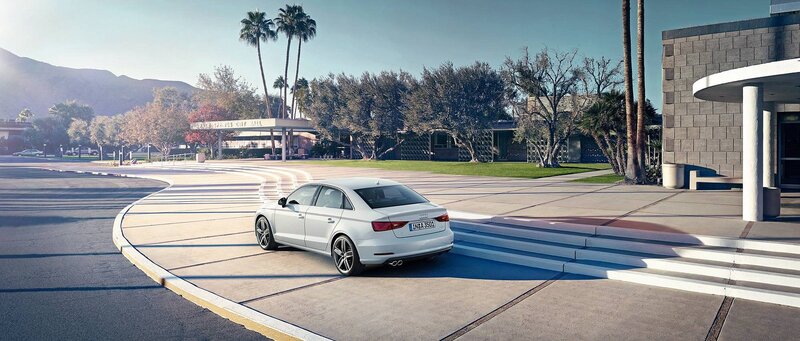 White Audi on a curved driveway