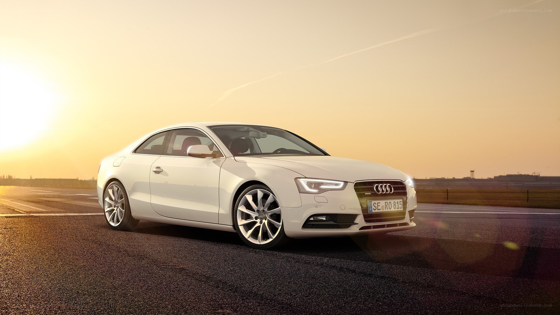 White Audi on a racetrack