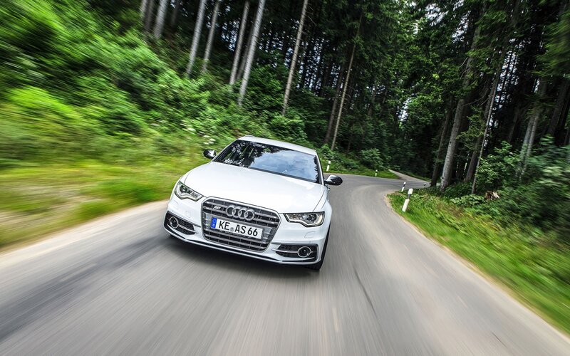 White Audi on forest road
