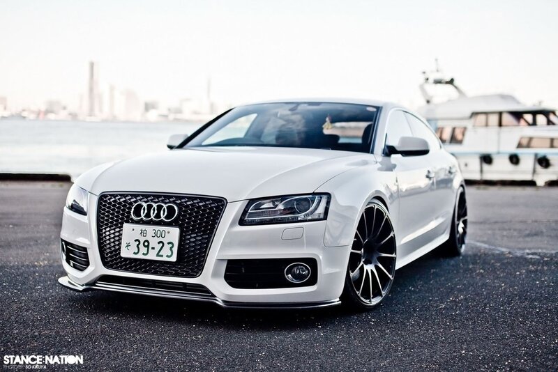 White Audi parked by the water