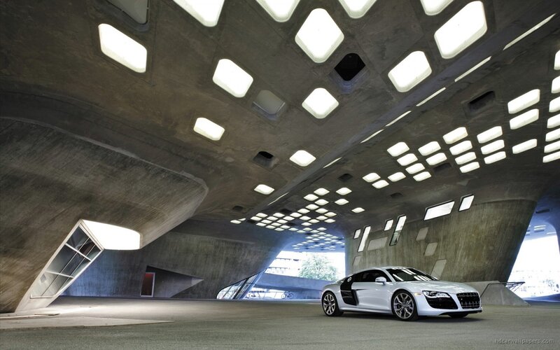 White Audi R8 in modern concrete structure