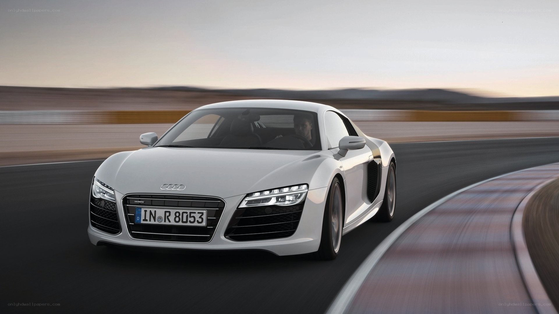 White Audi R8 on a racetrack