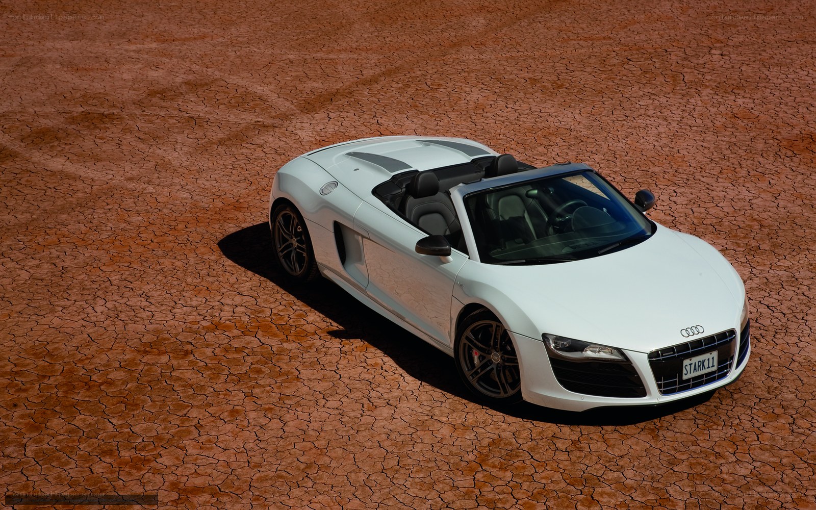 White Audi R8 on cracked earth