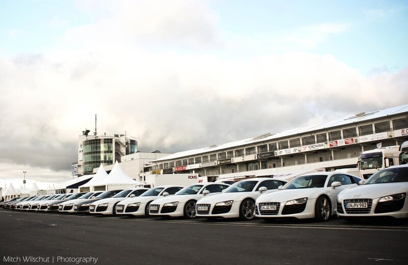 White Audi R8s at a race track