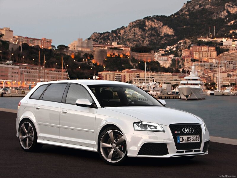 White Audi RS3 at a coastal port