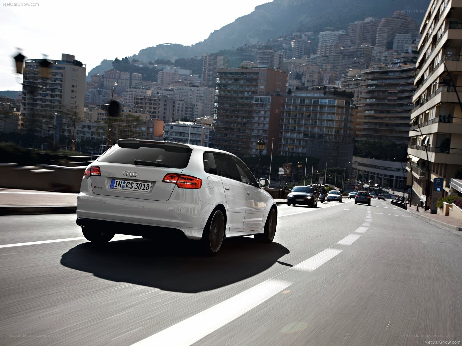 White Audi RS3 driving in Monaco