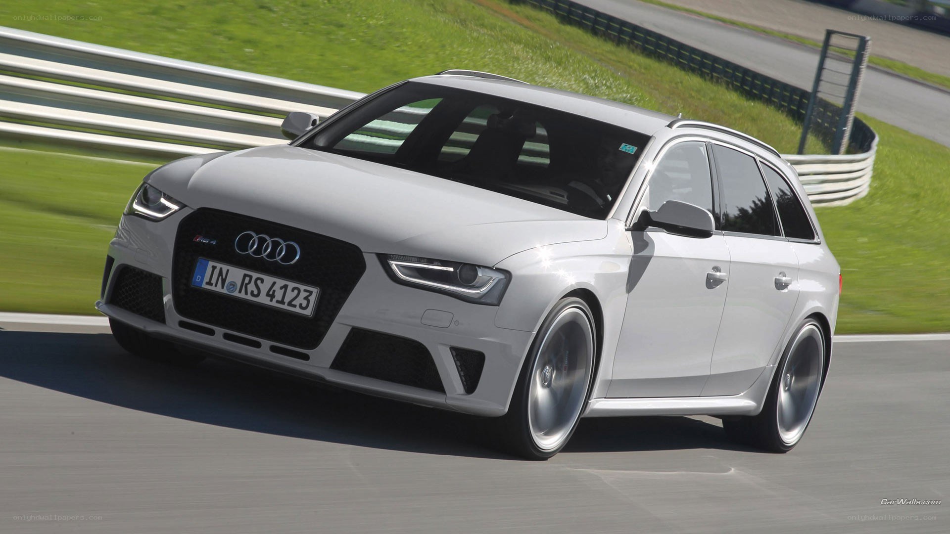 White Audi RS4 on a racetrack