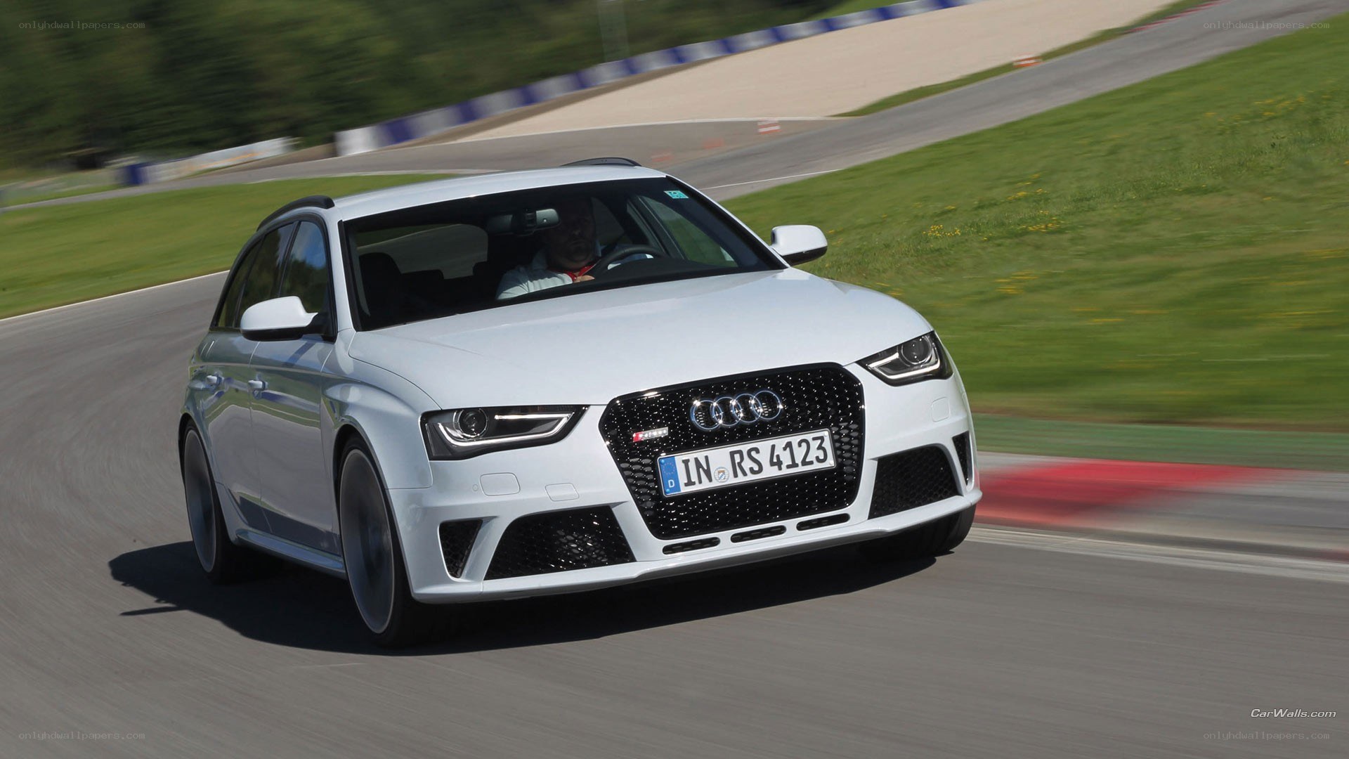 White Audi RS4 on a racetrack