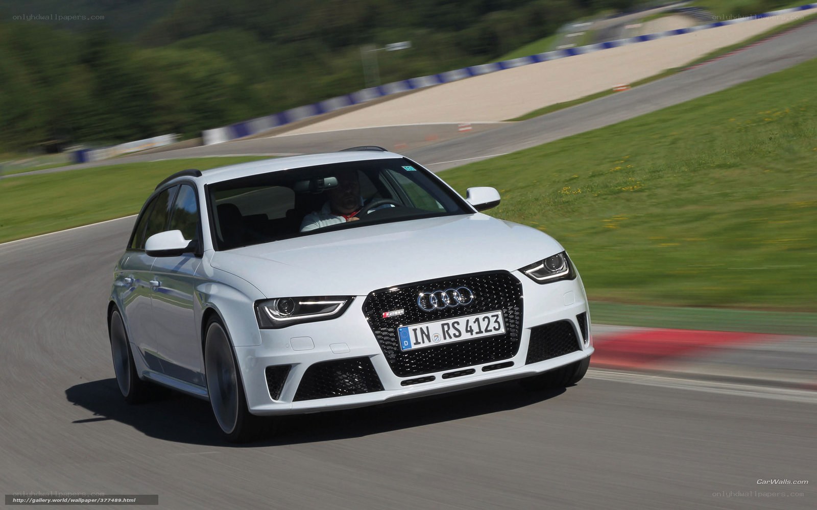 White Audi RS4 on a racetrack