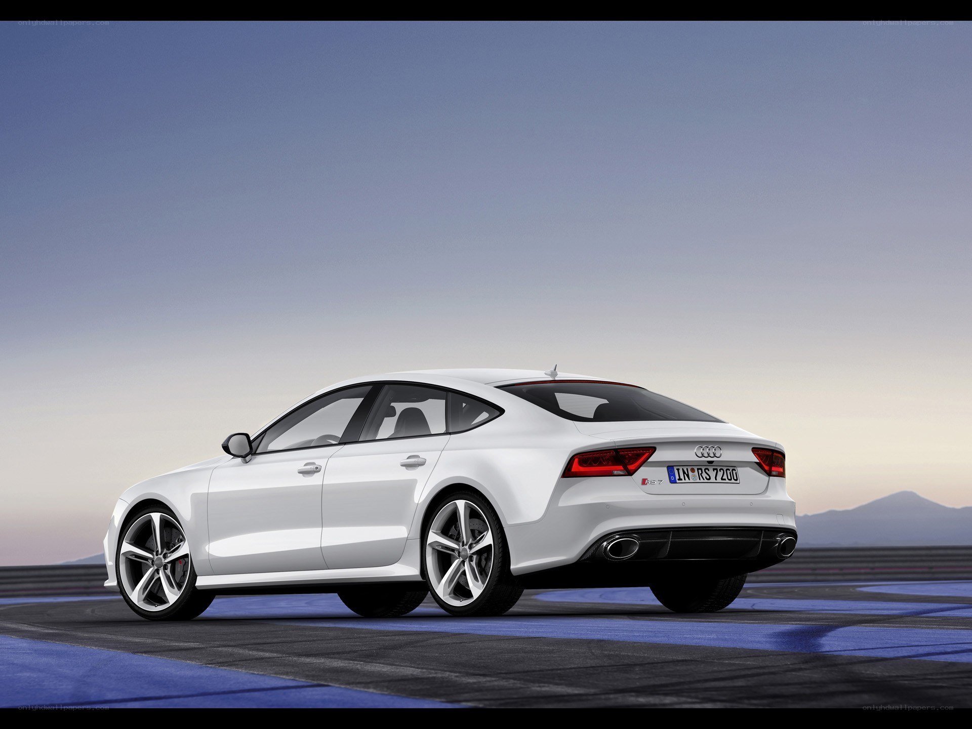 White Audi RS7 on racetrack