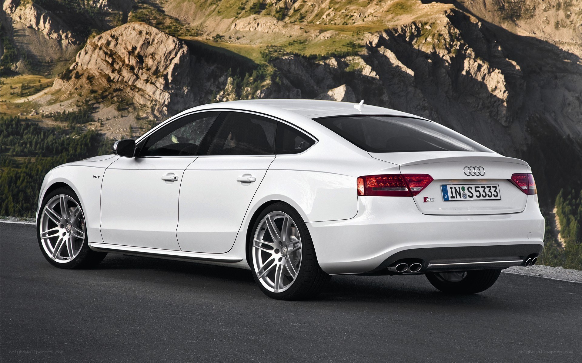 White Audi S5 on mountain road