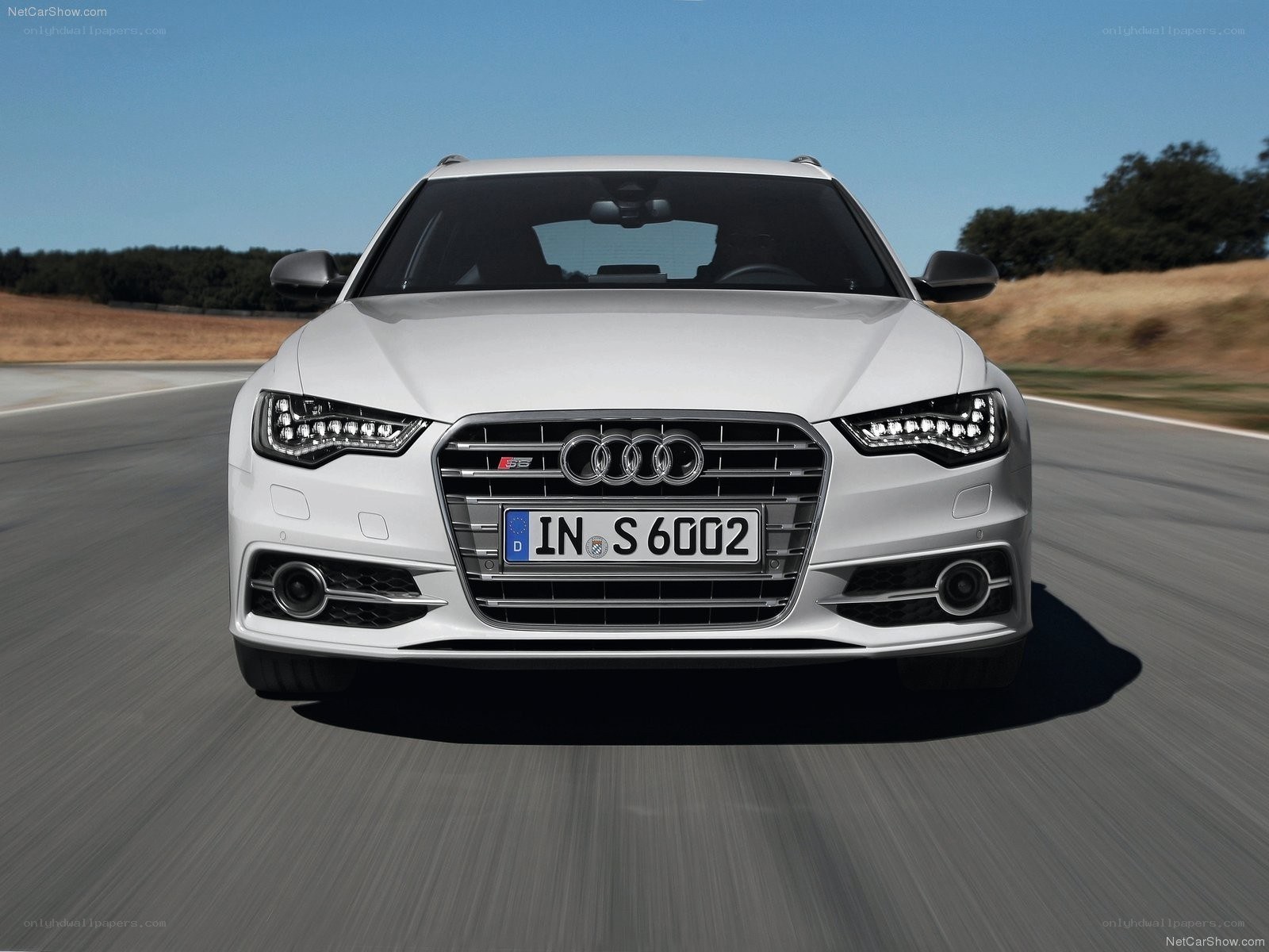 White Audi S6 driving on road