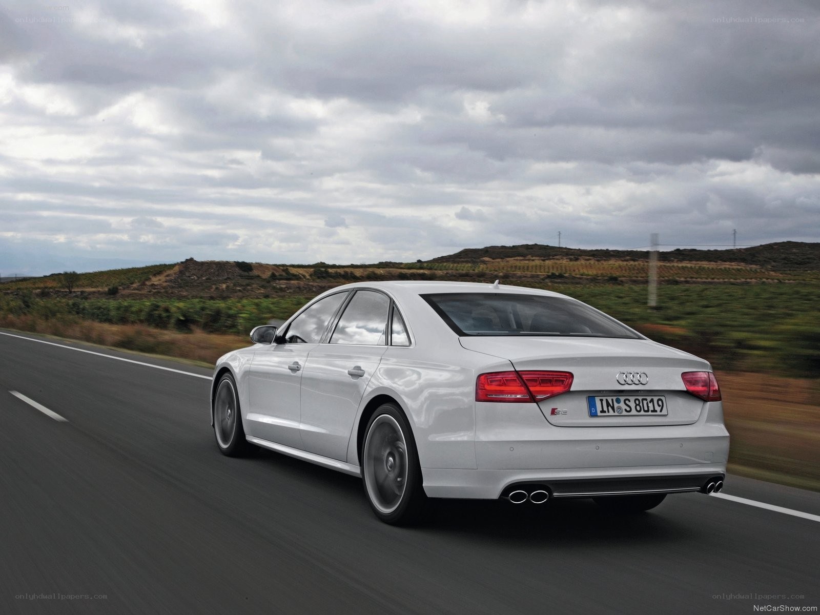 White Audi S8 driving on road