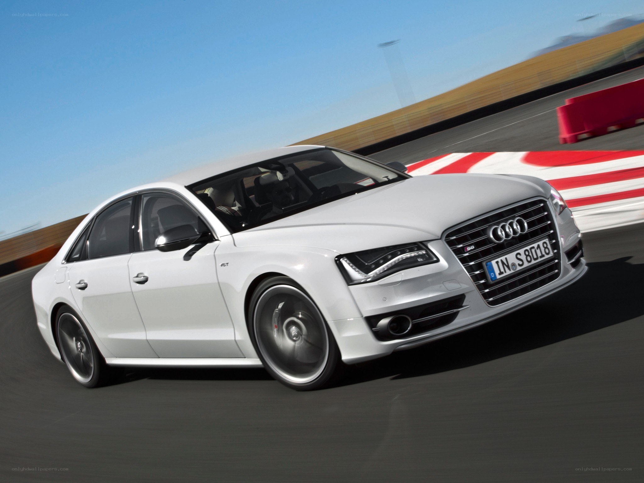 White Audi S8 on a racetrack