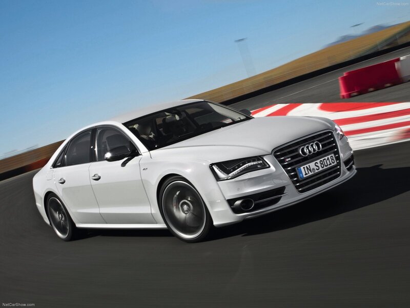 White Audi S8 on a racetrack