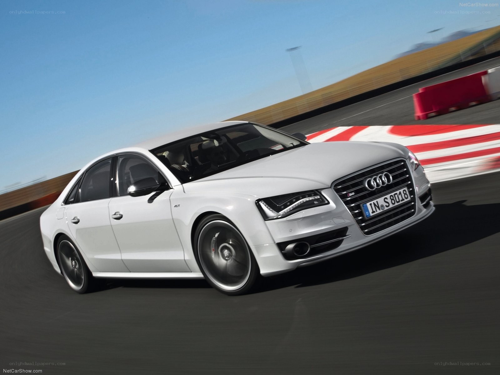 White Audi S8 on a racetrack