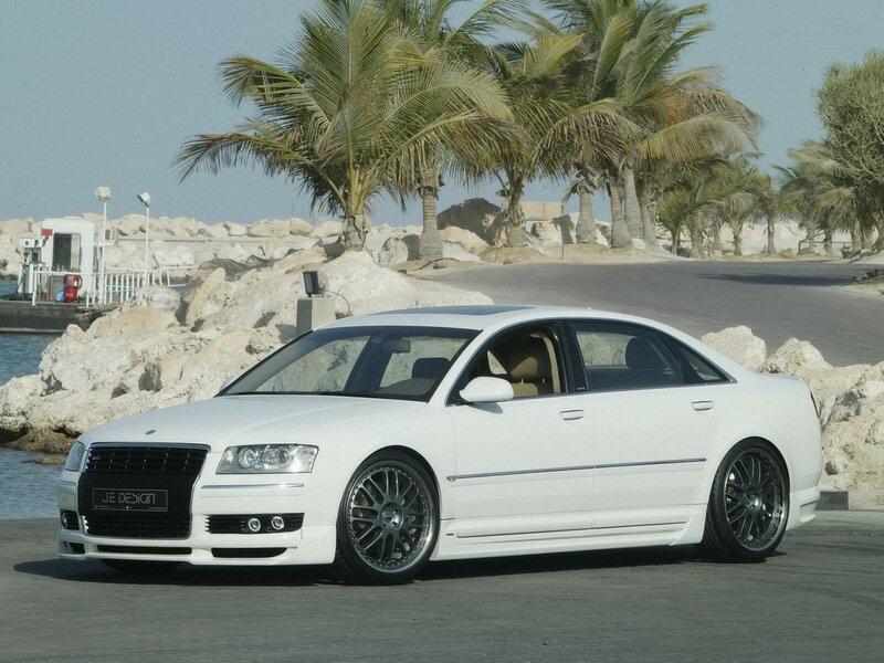 White Audi sedan by the coast