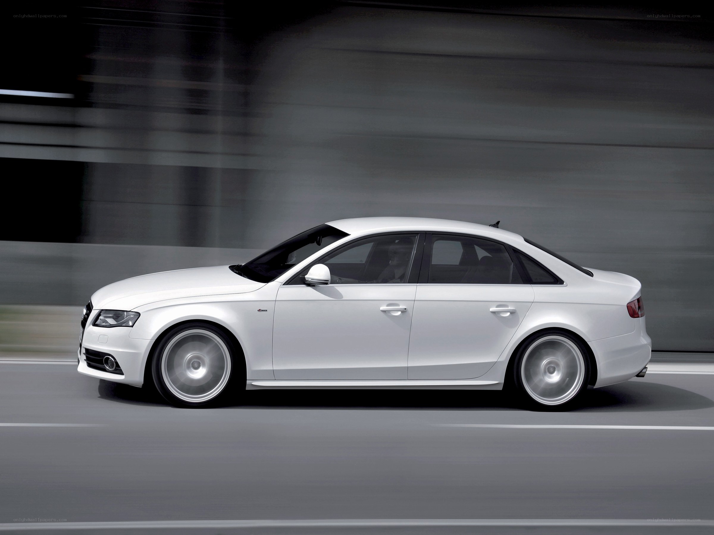 white audi sedan in motion