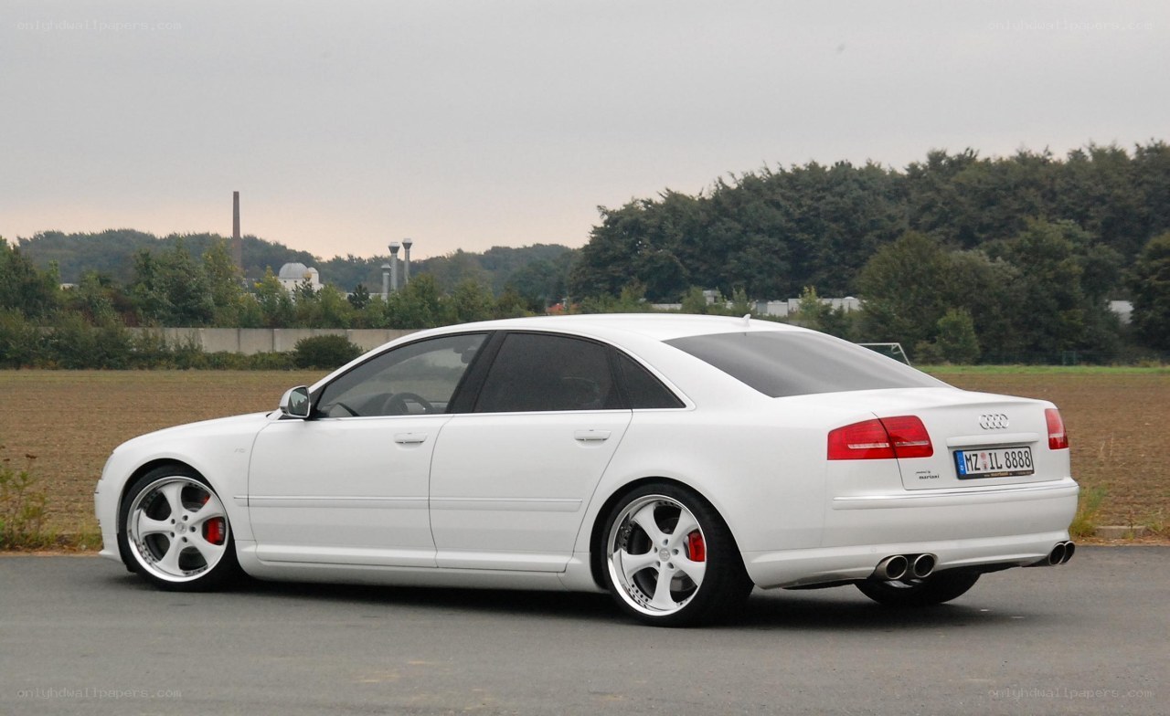 white audi sedan on asphalt