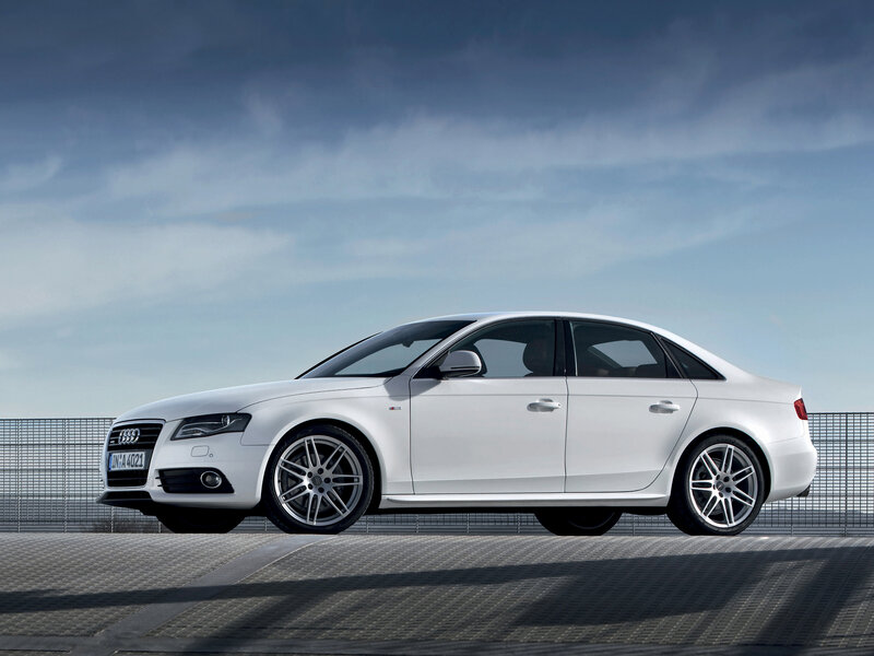 white audi sedan on platform