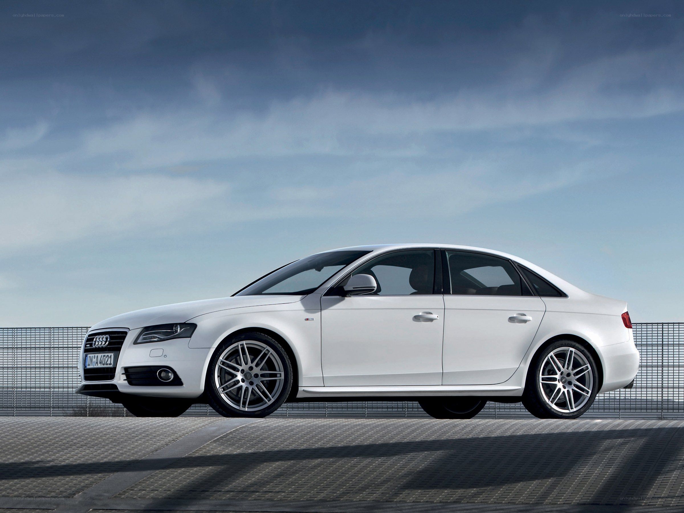 white audi sedan on platform